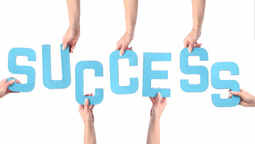 Female hands holding letters SUCCESS