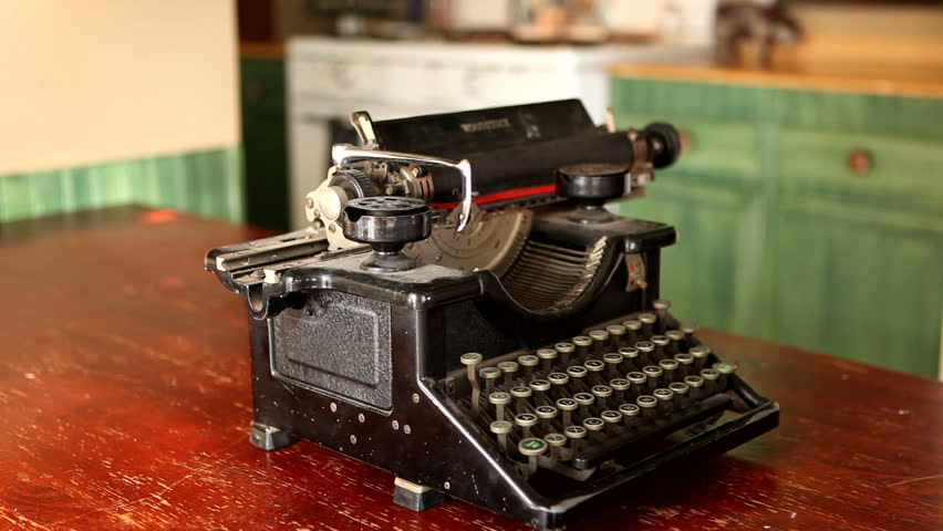 Old Vintage Typewriter Being Used By A Woman