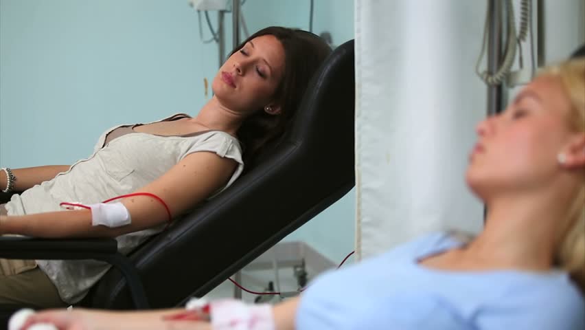 Two patients sleeping in hospital ward