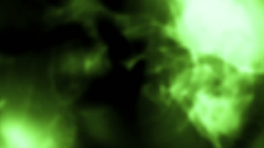 Green shapes appearing and changing form against a black background