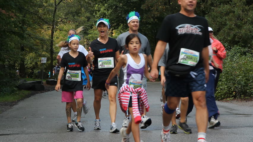 TORONTO, CANADA - SEPTEMBER 21st: Participants run, walk and jog in the Oasis Zoo run on September 21st, 2012. The Oasis Zoo run is a fundraising event, sponsored by the Oasis brand of fruit drinks. 