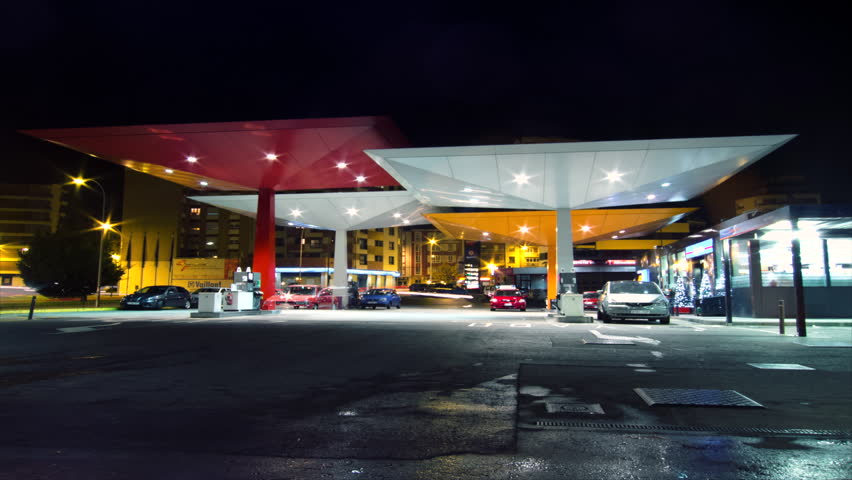 SPAIN - CIRCA 2012: Time lapse of several cars filling fuel at gas station at night circa 2012 in Spain.