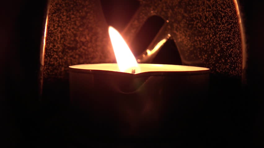 Beautiful candle lights in pitch black night
