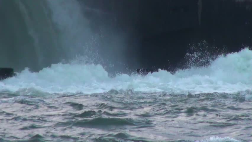 A close look at waterfall water hitting canal water