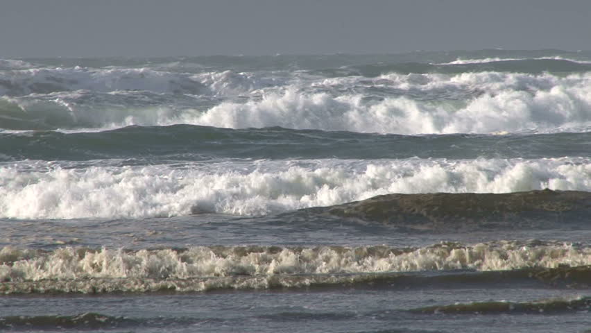 Pacific Ocean heavy, strong waves breaking with sound at high tide.