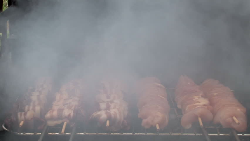 Barbecue cooked outdoors, close-up
