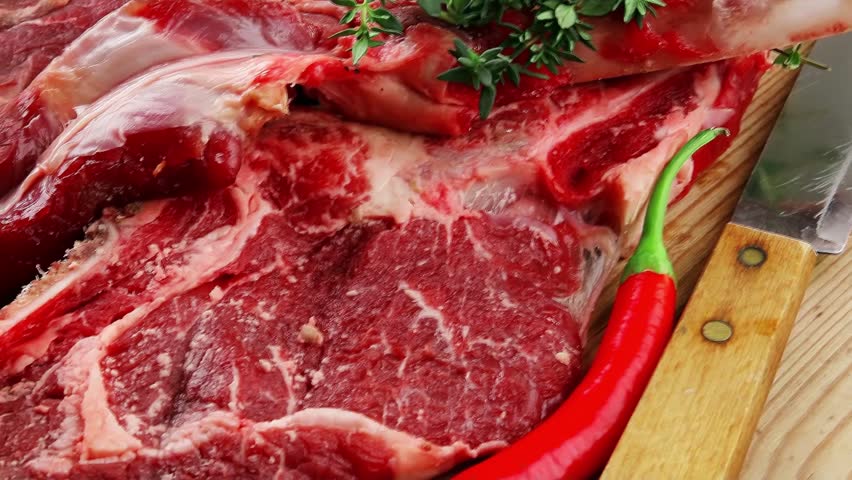 fresh spare ribs : raw lamb with thyme garlic and red chili pepper on wooden board