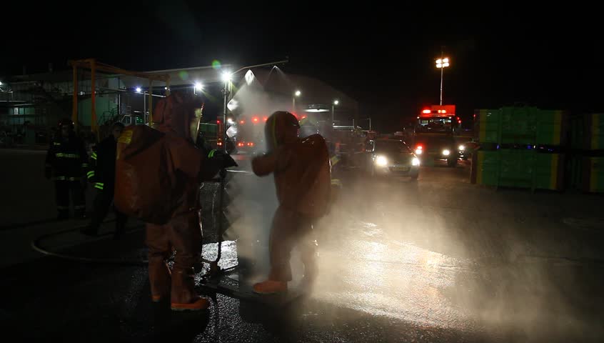 NORTHERN ISRAEL -DECEMBER 17: Firefighters practice leak accident of corrosive toxic hazardous material Ammonia liquid in seven food factories using protective suites, Northern Israel December 17 2012