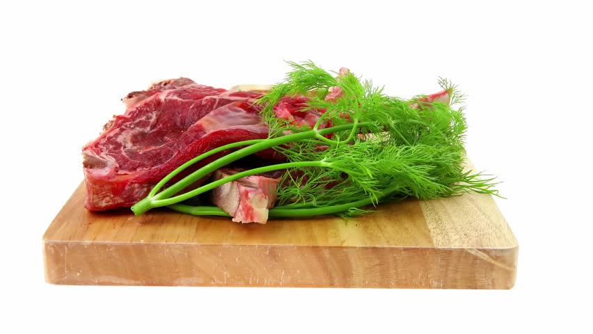 fresh spare ribs : raw pork with dill and green chives on wooden board isolated over white background