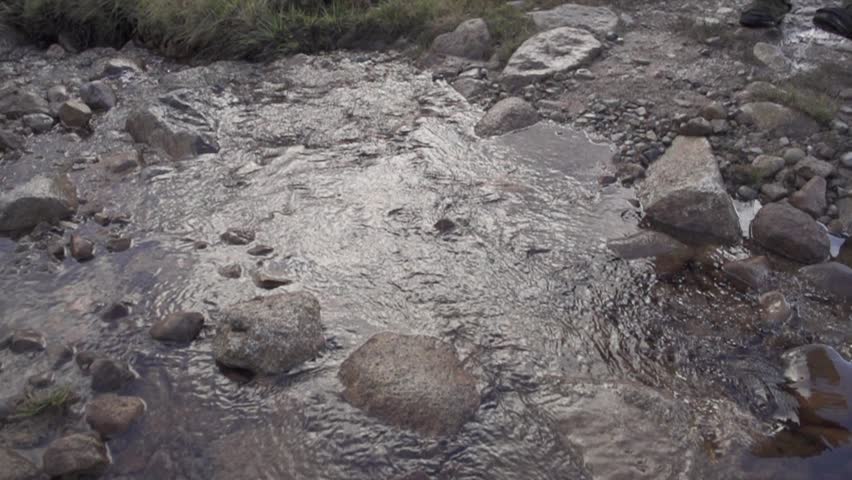 Hiking boot in water in Scotland - slow motion (1080p400 conformed to 1080p25)