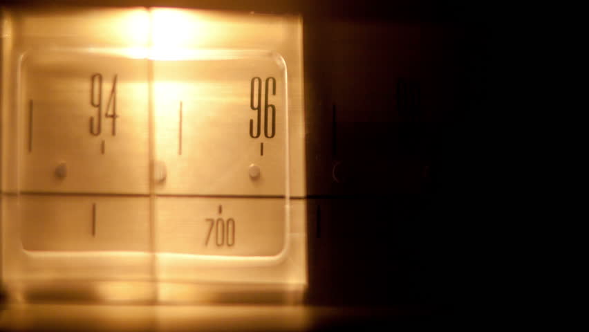 a glowing radio with the marker running through the different stations and frequencies