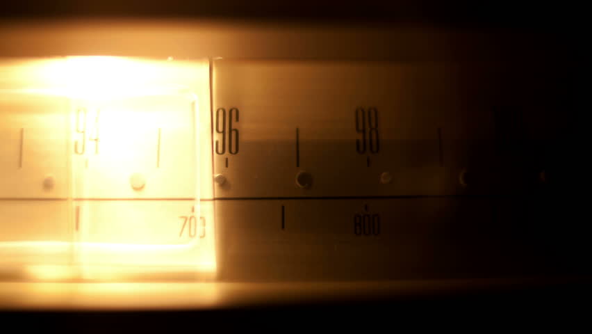 a glowing radio with the marker running through the different stations and frequencies
