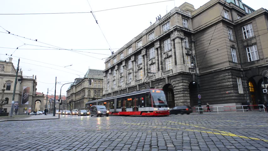 PRAGUE, CZECH REPUBLIC - JAN 6 2013: Early morning traffic in the center of the Prague, Czech Republic. Close to the Jan Palach Square with the view of The Faculty of Arts of Charles University.