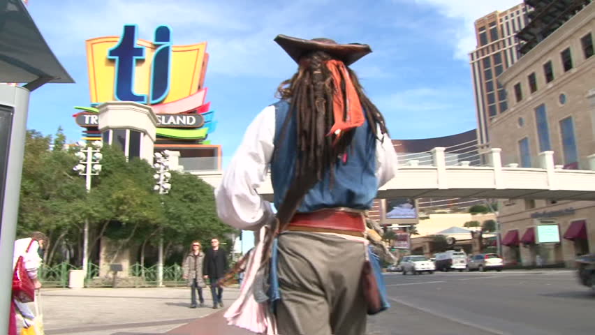 LAS VEGAS, NEVADA - CIRCA 2012: Captain Jack Sparrow impersonator from the Pirates of the Caribbean walking Las Vegas Boulevard Strip turns around and waves to camera.