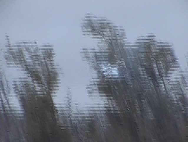 a remote control helicopter is flown with precision timing in an empty field