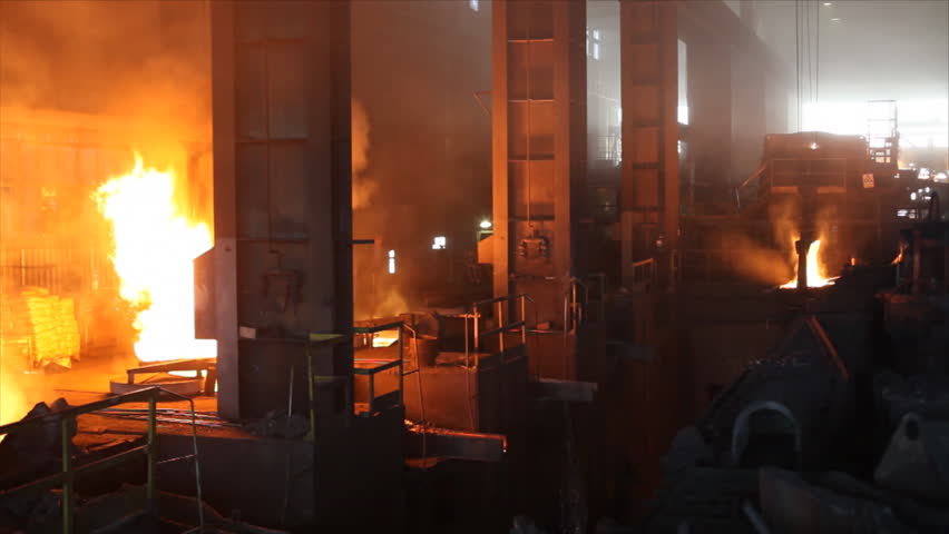 Hard work in the Foundry, liquid metal in the factory, smelting iron and processing