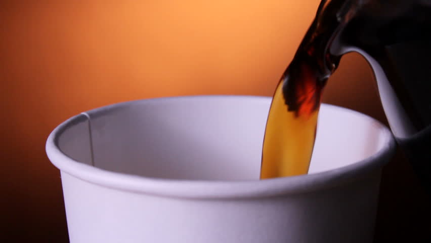 Coffee poured into a cardboard cup