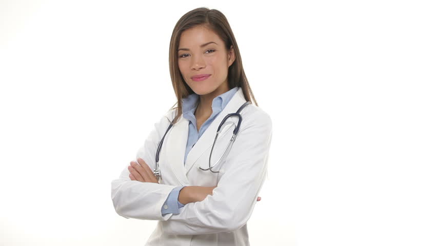 Young medical doctor woman walking in, smiling proud, crossing arms and looking at camera. Portrait of Young medical professional with stethoscope and lab coat isolated on white background.