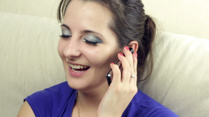 Portrait  of a beautiful young woman talking on the phone