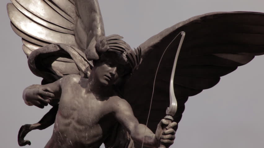 A stationary close-up shot of metal Eros statue located on Piccadilly Circus in London. 