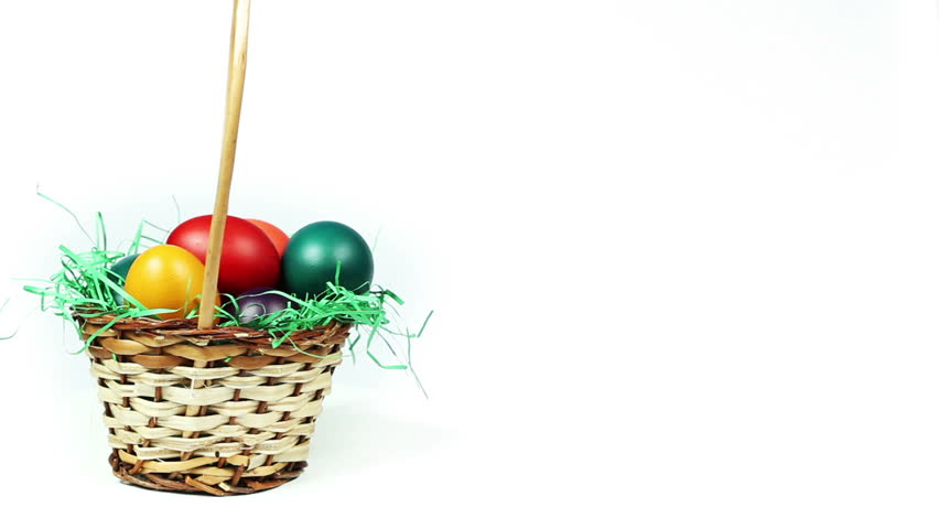 Basket of Easter Eggs - Colorful Easter eggs in a basket with green grass decoration, white background, seamless loop