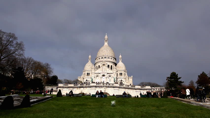 PARIS, FRANCE - DECEMBER 26, 2011 Tourists visit Sacre Coeur Basilica of the Sacred Heart of Jesus Montmartre
