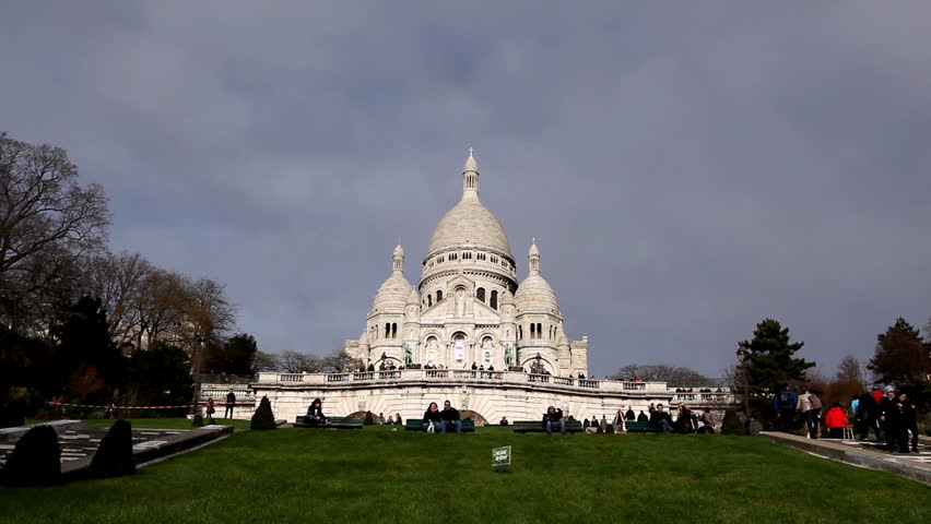 PARIS, FRANCE - DECEMBER 26, 2011 Tourists visit Sacre Coeur Basilica of the Sacred Heart of Jesus Montmartre