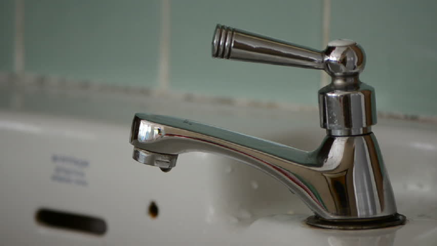 water pipe flowing at basin
