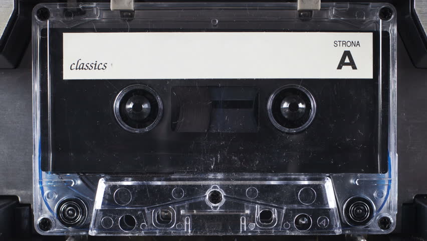 sequence of old audio cassettes in a retro tape player

