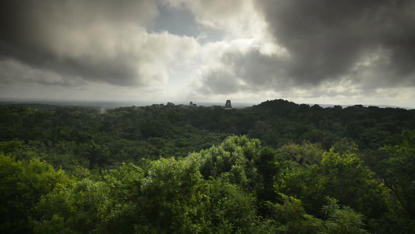 Clouds sweep over the major pyramids of Tikal National Park, time lapse