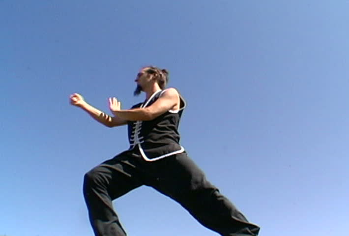 Video of man meditating and doing tai-chi in a natural surrounding with plenty of space to ad your own elements.
