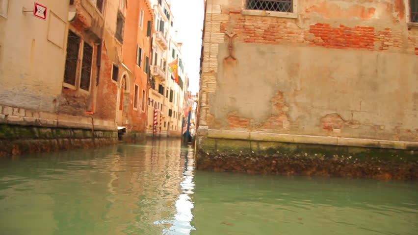 The base of buildings at a canal intersection