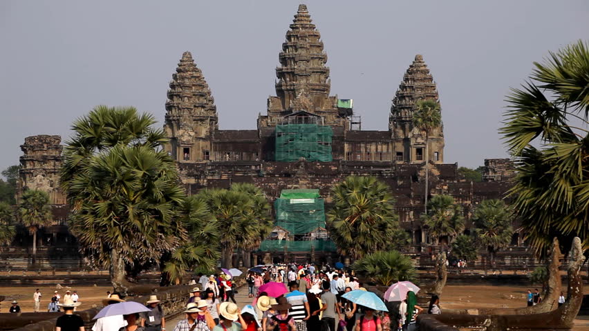 ANGKOR WAT, CAMBODIA - FEBRUARY 16, 2011 - People visit Angkor Wat Temple, Cambodia, The World's Largest Religious Building