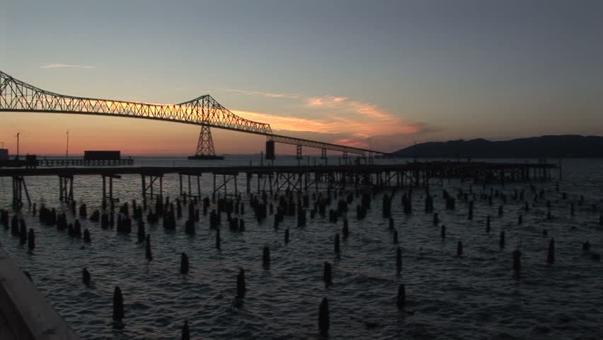 Astoria bridge at dusk with pilings, Oregon