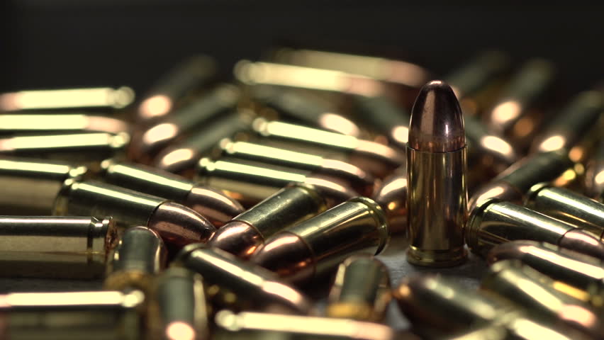 Macro shot of 9 mm handgun Bullets. Dollies to the right