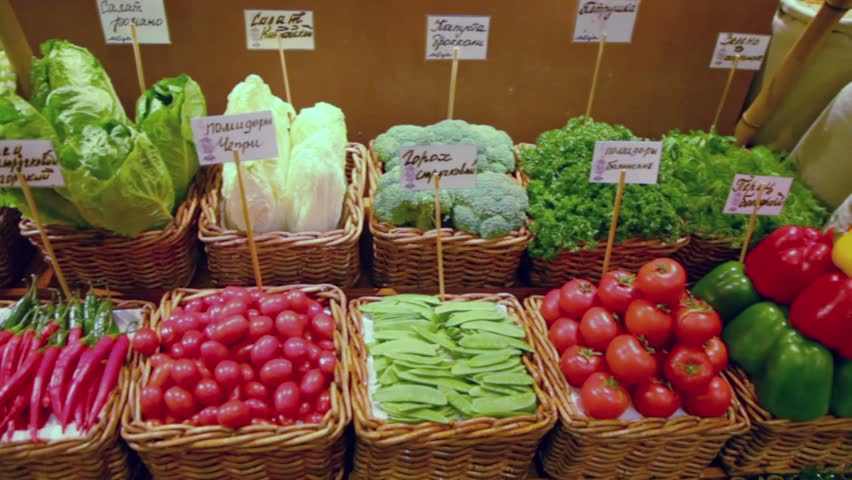 Different vegetables lay in baskets at market place