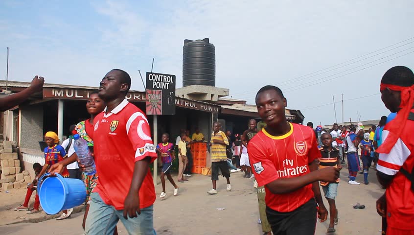 ACCRA, GHANA - CIRCA DEC 2012: People in the street during the Homowo Festival in Accra, Ghana circa December 2012. Celebrated by the Ga people in remembrance of a historical famine.