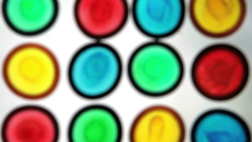 Colourful condoms on white surface
