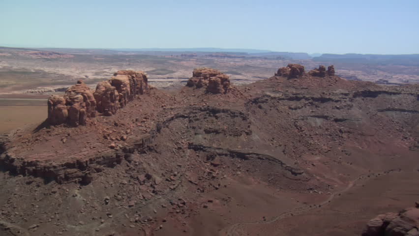 aerial shots of red rock desert buttes and sage desert