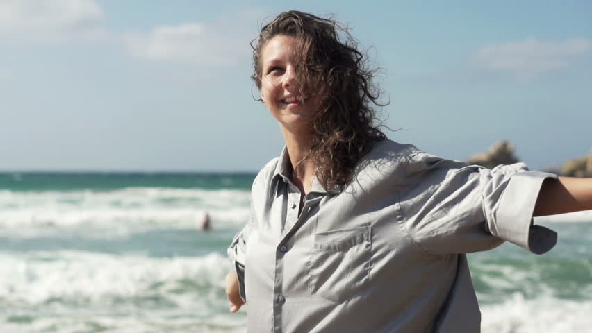 Happy excited woman by the sea, super slow motion, shot at 240fps
