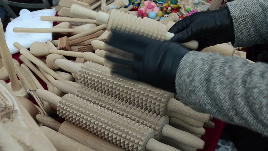 hand made wooden kitchen utensil tools pin rolling-pins and hand with glove choose it in city market fair