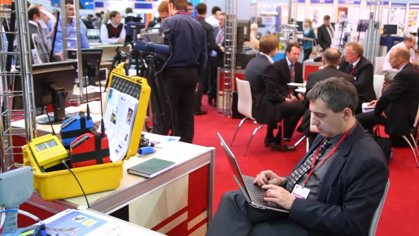 MOSCOW - FEB 28: Company employee sitting at stand at Expo Coating, on fib 28, 2013 in Moscow, Russia. Many different industries are interested in innovations presented at ExpoCoating