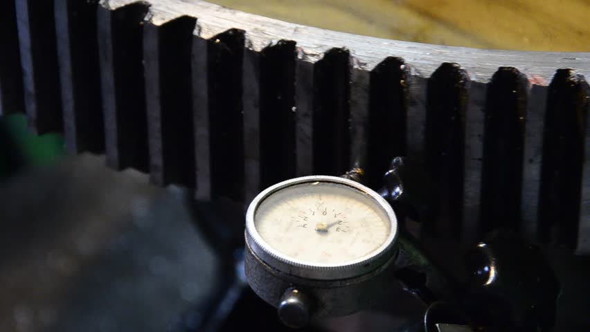 dial gauge instrument measures inclination of cogwheel gear ready for service