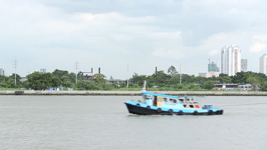 Tug boat with freight ship in the river