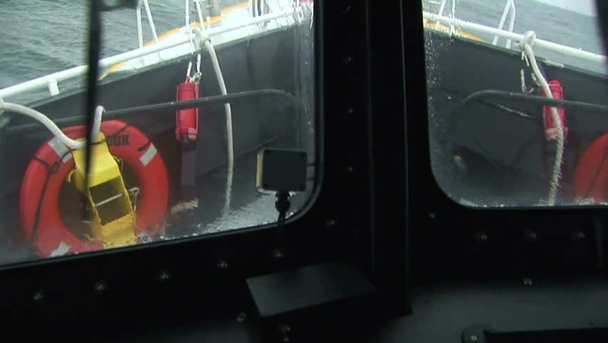 Pilot boat with view of life preserves in agitated waters on the Columbia River, OR
