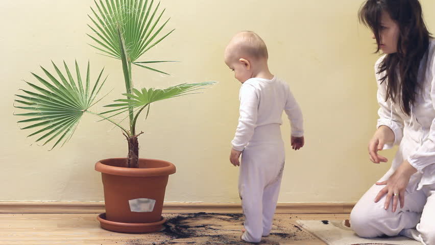 mother cleaning up babys mess