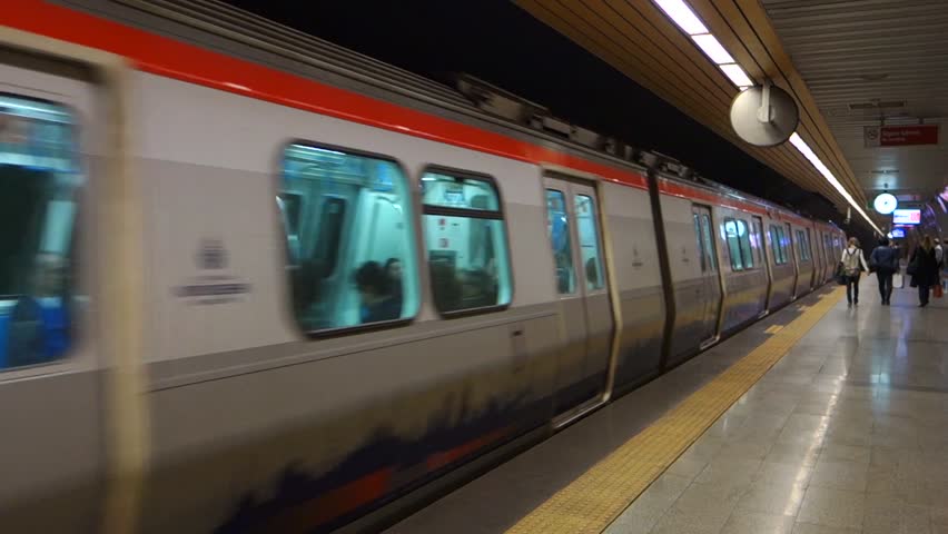 ISTANBUL â TURKEY â MARCH 30: Metro train arriving and departing in Osmanbey underground station on March 30, 2013, in Istanbul Turkey.