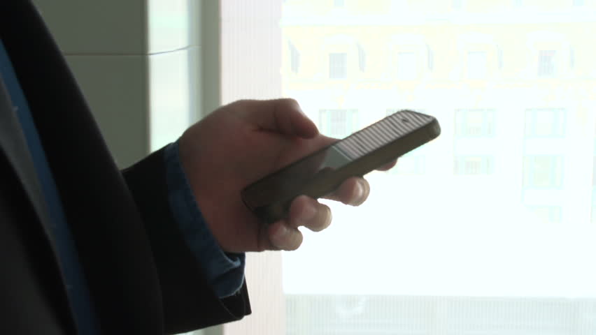 Business man on his smart phone