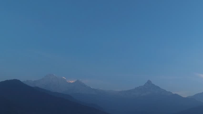 Timelapse of morning light touches Annapurna III and Annapurna IV mountains and Fish Tail mountain (Machapuchare mountain) on the right (Annapurna range). Captured from Dhampus, Pokhara, Nepal