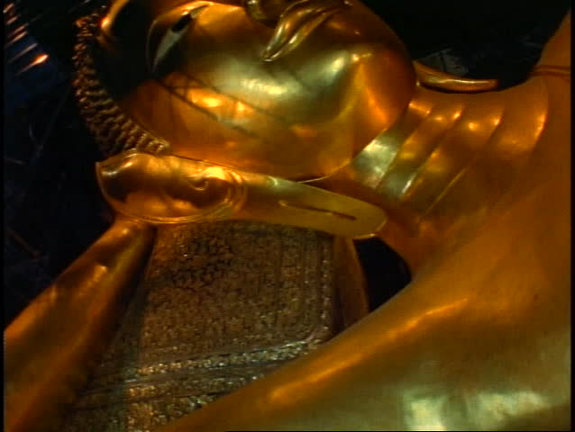 Temple of the Reclining Buddha, The Golden Buddha, close up face of gold, tilt up